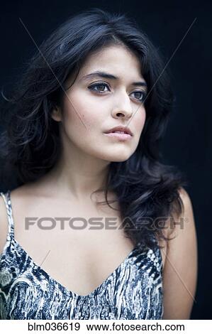 Stock Photo - Close up of serious mixed race woman. Fotosearch