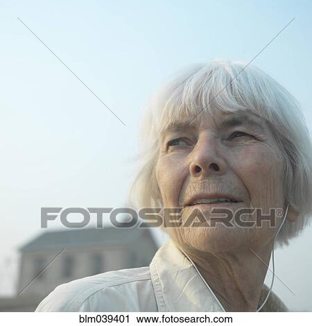 Stock Image - Close up of serious older woman. Fotosearch