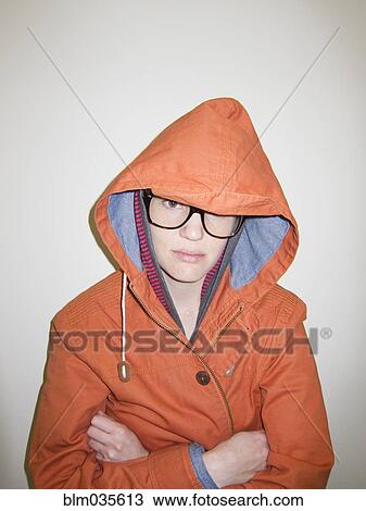 Close up of serious woman wearing raincoat and eyeglasses View Large Photo Image Stock Image - Close up of serious woman wearing raincoat and eyeglasses. Fotosearch
