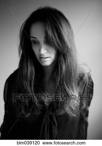Close up of serious woman with long hair View Large Photo Image Stock Image - Close up of serious woman with long hair. Fotosearch