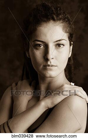Stock Photo - Close up of serious woman with dreadlocks. Fotosearch