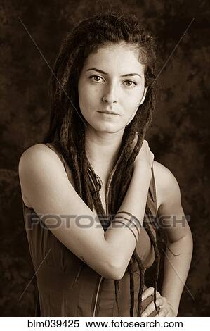 Stock Photography - Close up of serious woman with dreadlocks. Fotosearch