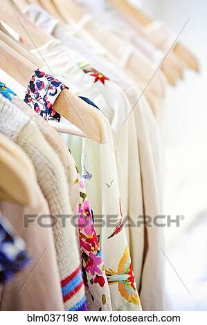 Close up of shirts on hangers View Large Photo Image Stock Photo - Close up of shirts on hangers. Fotosearch