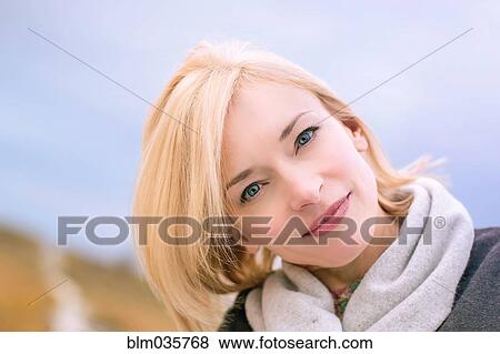 Close up of smiling Caucasian woman tilting head View Large Photo Image Stock Photo - Close up of smiling Caucasian woman tilting head. Fotosearch