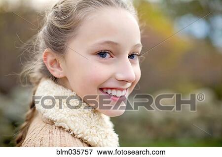 Stock Photo - Close up of smiling girl. Fotosearch