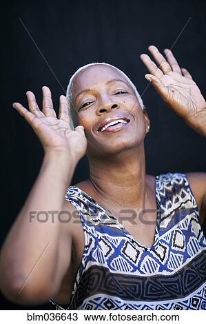 Close up of smiling woman dancing View Large Photo Image Stock Image - Close up of smiling woman dancing. Fotosearch