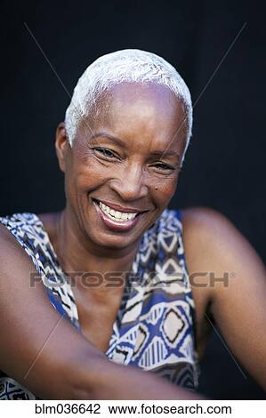 Stock Image - Close up of smiling woman. Fotosearch