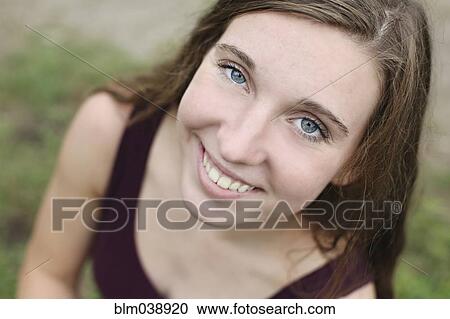 Close up of smiling woman View Large Photo Image Stock Image - Close up of smiling woman. Fotosearch