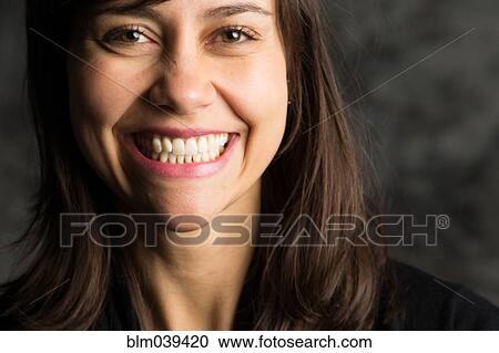 Stock Image - Close up of smiling woman. Fotosearch