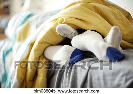 Close up of socks of couple in bed View Large Photo Image Stock Photography - Close up of socks of couple in bed. Fotosearch
