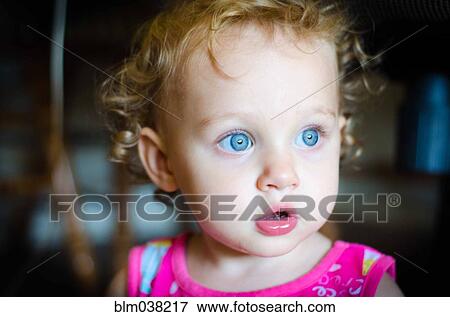 Close up of surprised baby girl View Large Photo Image Stock Photo - Close up of surprised baby girl. Fotosearch