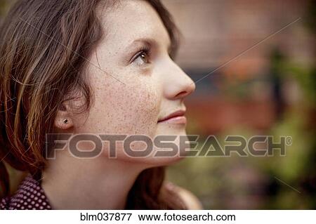 Close up of teenage girl looking up View Large Photo Image Stock Photo - Close up of teenage girl looking up. Fotosearch