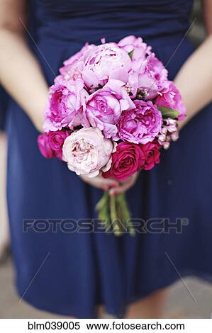 Close up of woman carrying bouquet of flowers View Large Photo Image Stock Photography - Close up of woman carrying bouquet of flowers. Fotosearch