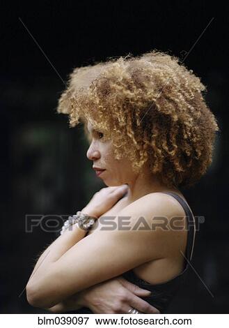 Close up of woman hugging her chest View Large Photo Image Stock Photo - Close up of woman hugging her chest. Fotosearch