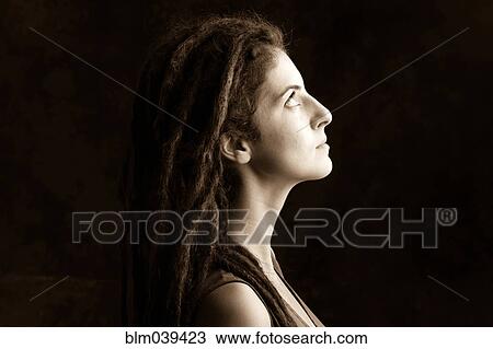 Close up profile of serious woman with dreadlocks View Large Photo Image Stock Image - Close up profile of serious woman with dreadlocks. Fotosearch