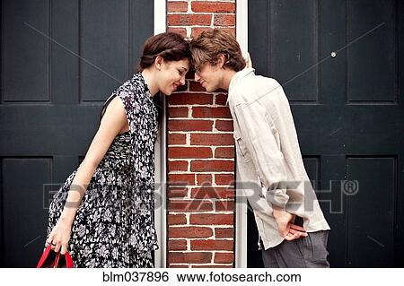 Couple touching foreheads in doorways View Large Photo Image Stock Photograph - Couple touching foreheads in doorways. Fotosearch