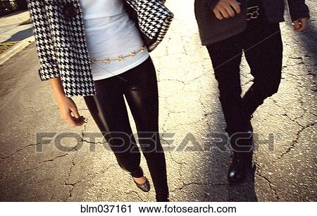 Couple walking on cracked street View Large Photo Image Stock Image - Couple walking on cracked street. Fotosearch