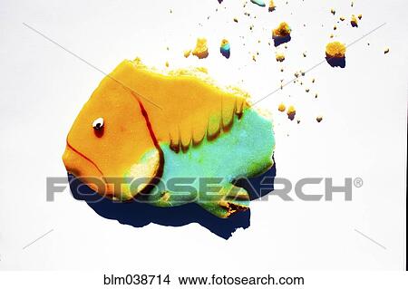 Crumbling cookie in fish shape View Large Photo Image Picture - Crumbling cookie in fish shape. Fotosearch