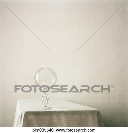Stock Image - Crystal ball on empty table. Fotosearch