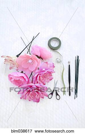 Fake flowers with tape and scissors View Large Photo Image Stock Photo - Fake flowers with tape and scissors. Fotosearch