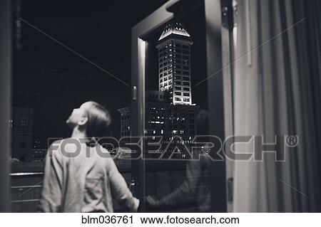Girl admiring view from balcony doorway View Large Photo Image Stock Image - Girl admiring view from balcony doorway. Fotosearch