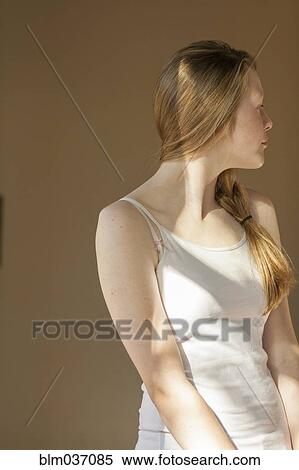 Stock Photography - Girl looking over her shoulder. Fotosearch