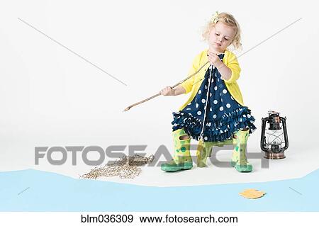 Girl playing fishing with toy fish View Large Photo Image Stock Photo - Girl playing fishing with toy fish. Fotosearch