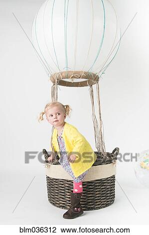 Girl playing in pretend hot air balloon View Large Photo Image Stock Image - Girl playing in pretend hot air balloon. Fotosearch