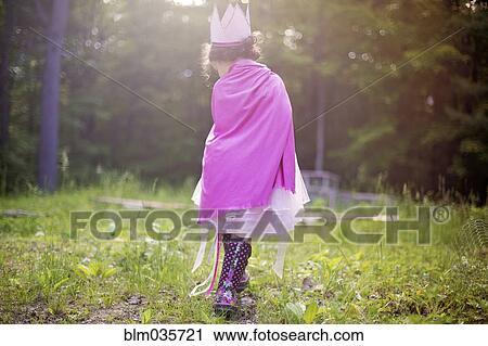 Girl playing princess in backyard View Large Photo Image Stock Image - Girl playing princess in backyard. Fotosearch
