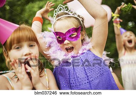 Girls playing dress-up at birthday party View Large Photo Image Stock Photograph - Girls playing dress-up at birthday party. Fotosearch