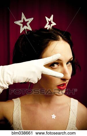 Stock Image - Glamorous woman posing in costume. Fotosearch