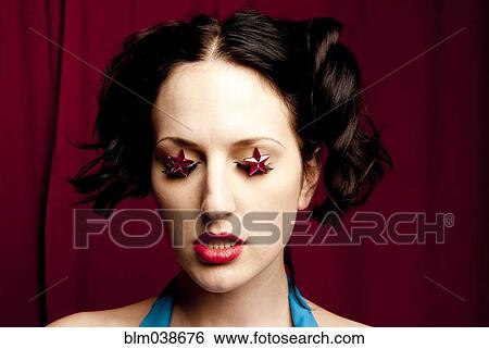 Glamorous woman wearing stars over eyes View Large Photo Image Stock Photograph - Glamorous woman wearing stars over eyes. Fotosearch