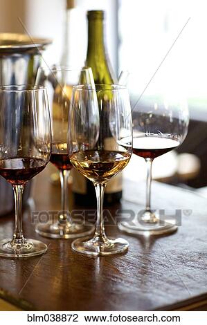 Glasses of red and white wine on table View Large Photo Image Stock Image - Glasses of red and white wine on table. Fotosearch