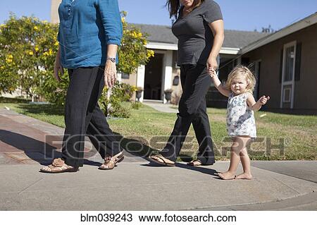 Grandmother, mother and daughter walking on sidewalk View Large Photo Image Stock Image - Grandmother, mother and daughter walking on sidewalk. Fotosearch