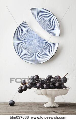 Grapes on platter under broken ceramic plate View Large Photo Image Stock Photograph - Grapes on platter under broken ceramic plate. Fotosearch