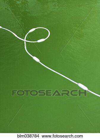 Picture - High angle view of buoy cord in lake. Fotosearch