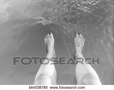 High angle view of legs of woman dangling in lake View Large Photo Image Stock Photography - High angle view of legs of woman dangling in lake. Fotosearch