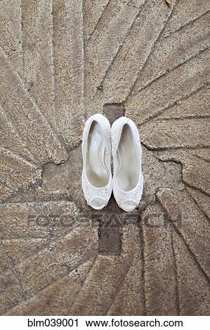 High angle view of white high heel shoes on concrete View Large Photo Image Stock Image - High angle view of white high heel shoes on concrete. Fotosearch