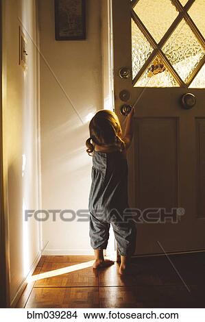 Hispanic preschooler girl opening front door View Large Photo Image Picture - Hispanic preschooler girl opening front door. Fotosearch