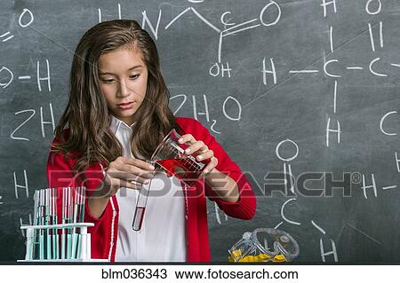 Hispanic student doing experiment in science class View Large Photo Image Stock Image - Hispanic student doing experiment in science class. Fotosearch