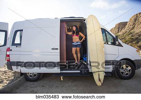 Hispanic surfer standing in van with surfboard View Large Photo Image Stock Image - Hispanic surfer standing in van with surfboard. Fotosearch