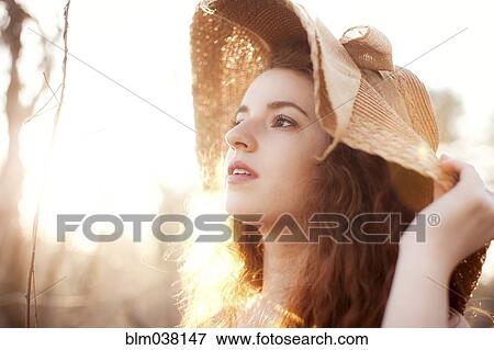 Hispanic woman wearing sun hat outdoors View Large Photo Image Stock Photo - Hispanic woman wearing sun hat outdoors. Fotosearch