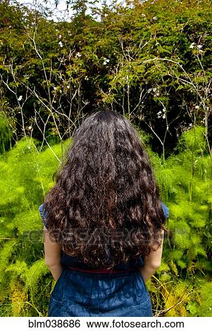 Iranian woman standing in garden View Large Photo Image Stock Photograph - Iranian woman standing in garden. Fotosearch