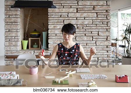 Japanese woman wrapping gifts View Large Photo Image Picture - Japanese woman wrapping gifts. Fotosearch