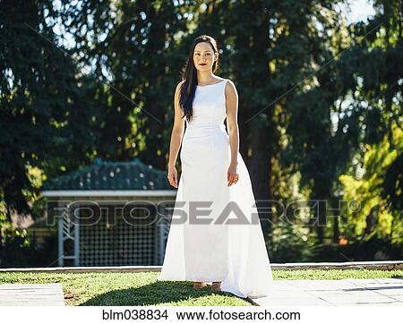 Korean bride smiling in park View Large Photo Image Picture - Korean bride smiling in park. Fotosearch