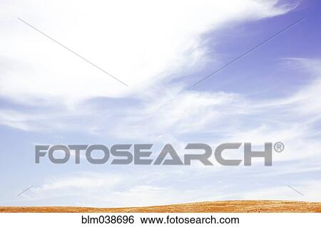 Stock Photograph - Landscape under clouds. Fotosearch