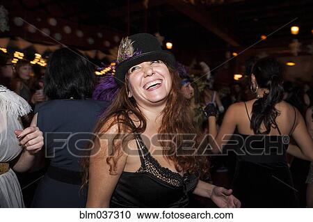 Stock Image - Laughing woman at party. Fotosearch