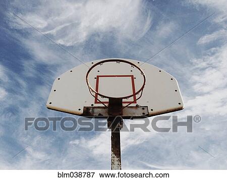 Low angle view of basketball hoop under blue sky View Large Photo Image Stock Photo - Low angle view of basketball hoop under blue sky. Fotosearch