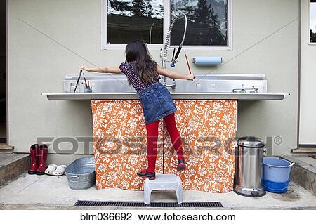 Mixed race girl cleaning paintbrushes in sink View Large Photo Image Stock Image - Mixed race girl cleaning paintbrushes in sink. Fotosearch