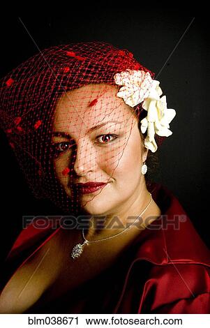 Stock Image - Mixed race woman wearing birdcage veil. Fotosearch